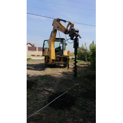 Оренда навісного гідравлічного ямобура на базі екскаватора-навантажувача Caterpillar 432f Київ