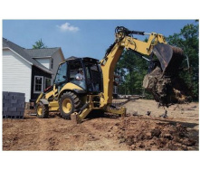 Выкорчевывание пней экскаватором-погрузчиком Caterpillar 428F