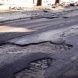 Киев коммунальный: Хотите избавиться от ям на дорогах - готовьте их фото