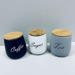 Набір керамічних банок з бамбуковими кришками BonaDi 304-034 Sugar/Tea/Coffee 3 шт 11,5х11,5х13 см 1 л Різнокольоровий (23523) Черкаси