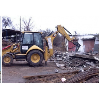 Демонтаж стены гидромолотом CAT H65